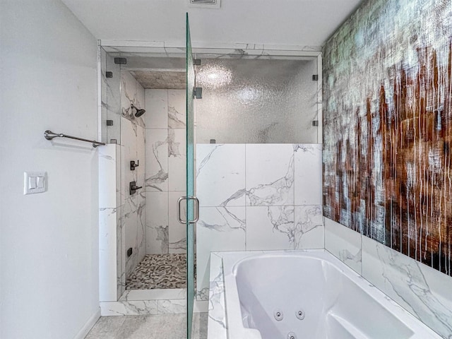 bathroom featuring separate shower and tub