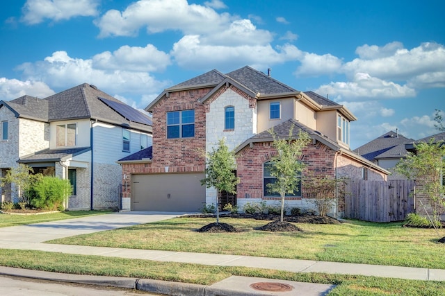 front of property with a front lawn and a garage