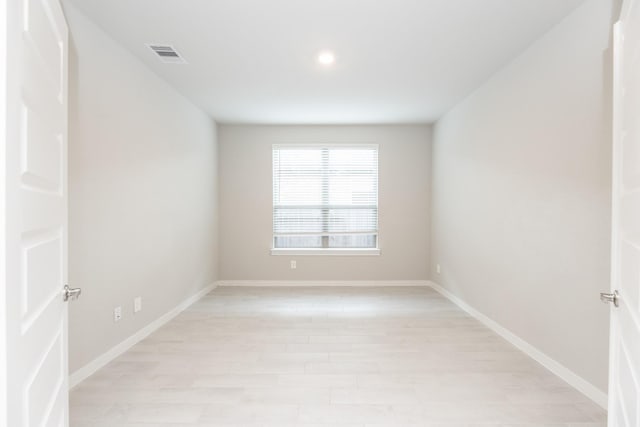 spare room with light hardwood / wood-style floors