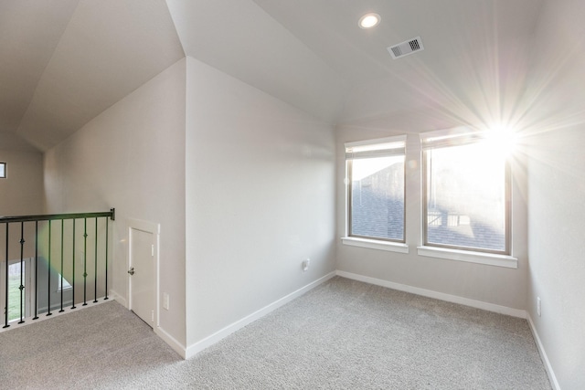 additional living space featuring lofted ceiling, carpet floors, and a wealth of natural light