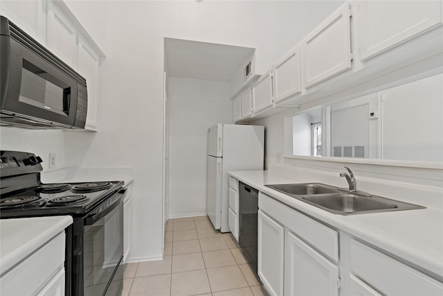 kitchen with sink, light tile patterned floors, black appliances, and white cabinets