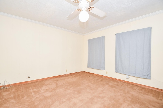 unfurnished room with carpet flooring, a textured ceiling, ceiling fan, and ornamental molding