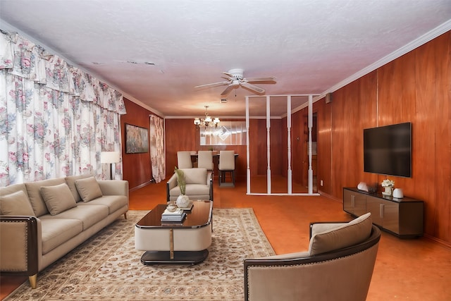 living room featuring crown molding, wooden walls, and a chandelier