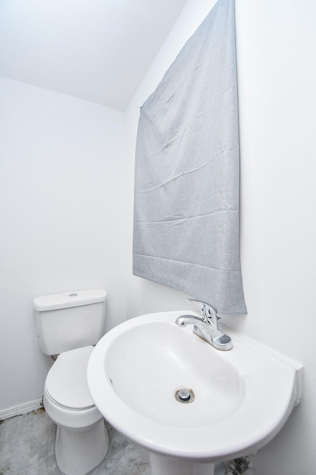 bathroom with toilet and sink