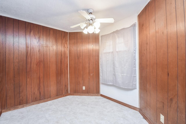 spare room with ceiling fan