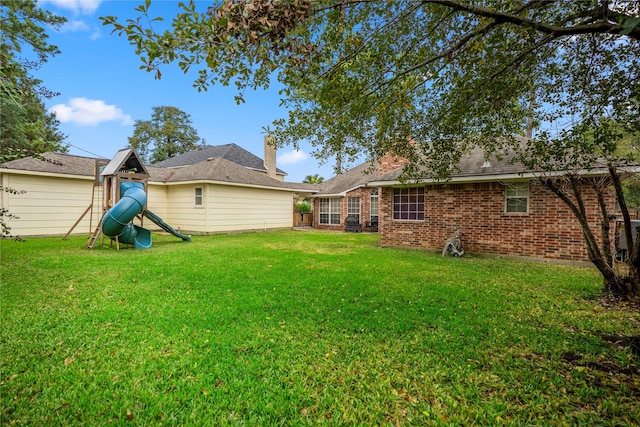 view of yard featuring a playground