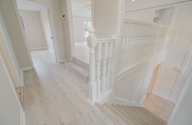 stairs with wood-type flooring