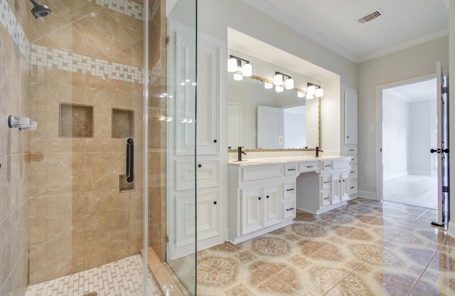 bathroom with tile patterned flooring, vanity, an enclosed shower, and ornamental molding