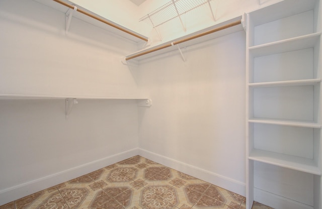 spacious closet featuring tile patterned floors