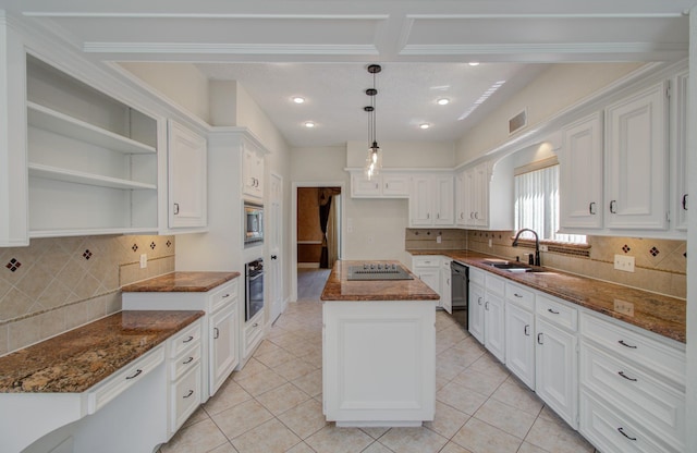 kitchen featuring sink, a kitchen island, dark stone countertops, white cabinets, and black appliances