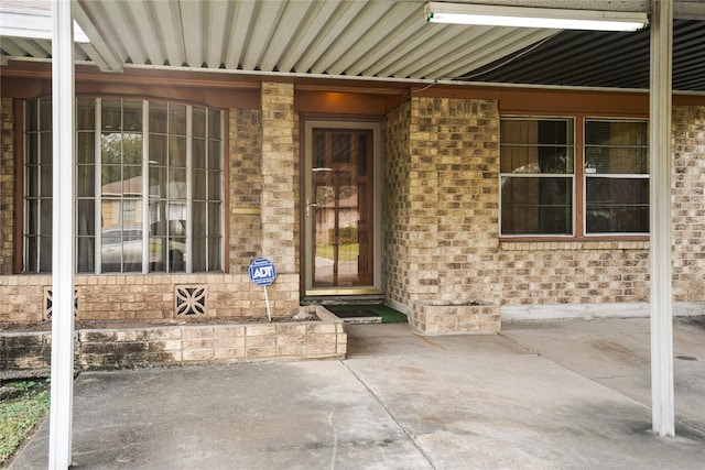 property entrance with a patio