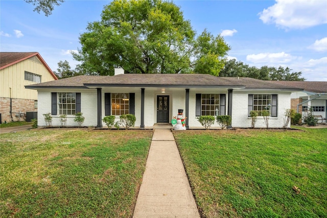 single story home with cooling unit, covered porch, and a front yard