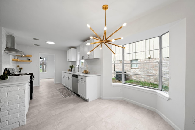 kitchen with white cabinetry, plenty of natural light, wall chimney exhaust hood, and stainless steel dishwasher