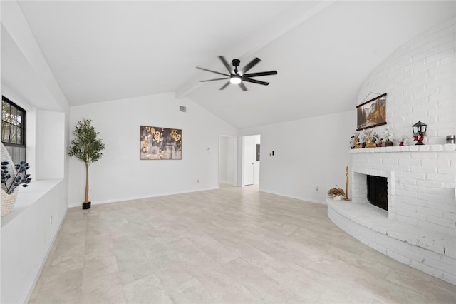 unfurnished living room featuring a fireplace, vaulted ceiling with beams, and ceiling fan