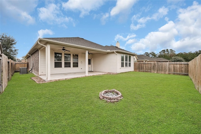 rear view of house featuring a patio, a yard, central AC unit, and ceiling fan