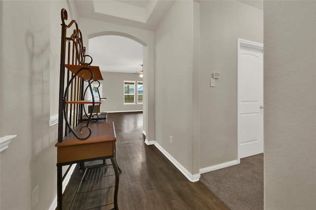 hallway with dark hardwood / wood-style floors