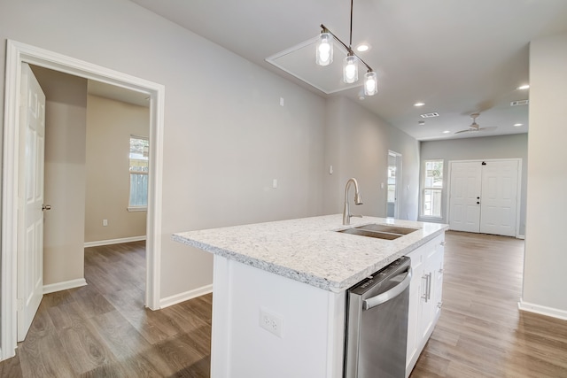 kitchen with white cabinets, a kitchen island with sink, sink, light hardwood / wood-style flooring, and dishwasher