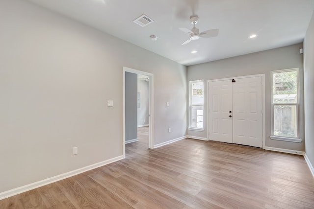 entryway featuring ceiling fan and light hardwood / wood-style floors