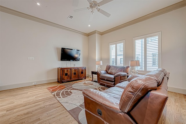 living room featuring ceiling fan, light hardwood / wood-style flooring, and ornamental molding