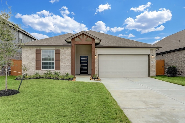 view of front facade featuring a front yard and a garage