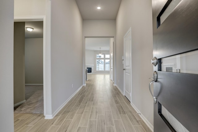 hall with light hardwood / wood-style floors