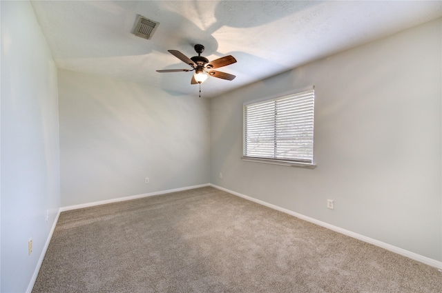 carpeted empty room featuring ceiling fan