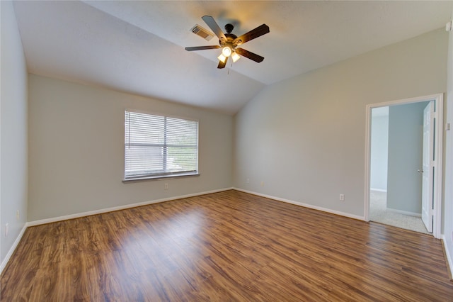 empty room featuring ceiling fan, dark hardwood / wood-style flooring, and lofted ceiling