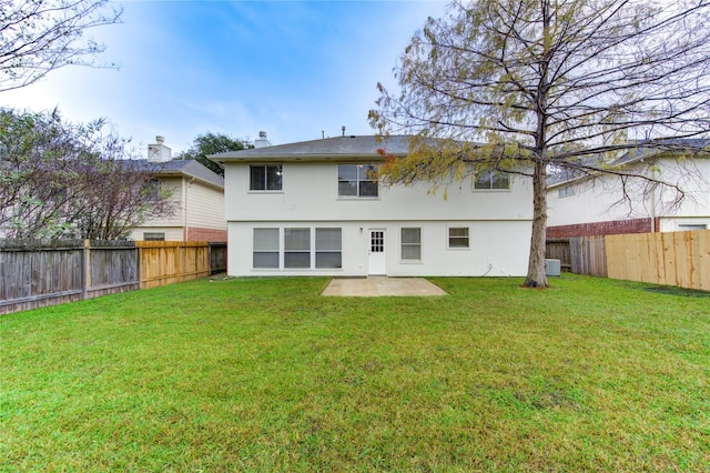 rear view of house with a patio area and a yard