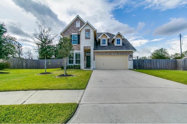 view of front of property featuring a front lawn and a garage