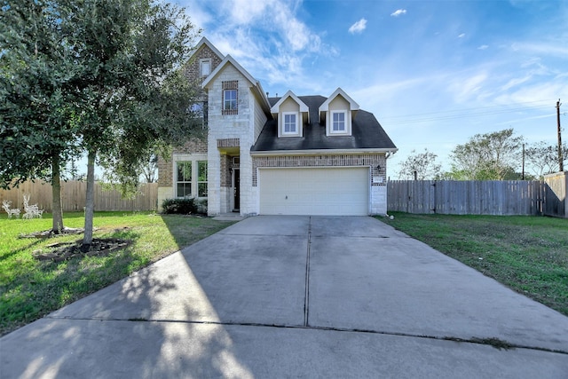 view of front of house featuring a garage and a front lawn