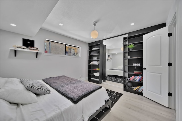 bedroom with light hardwood / wood-style floors