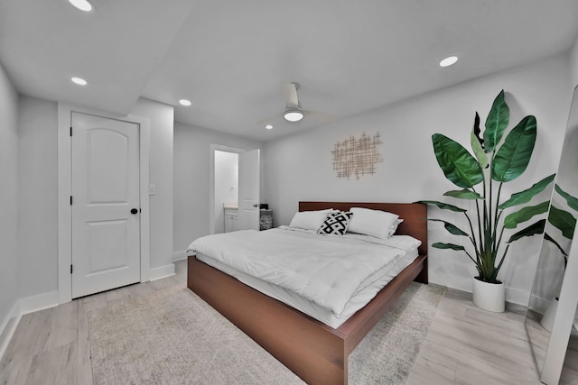 bedroom featuring light wood-type flooring and ceiling fan