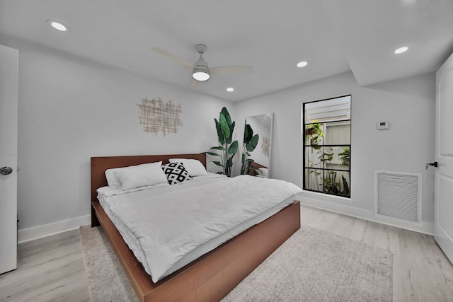 bedroom with light wood-type flooring and ceiling fan