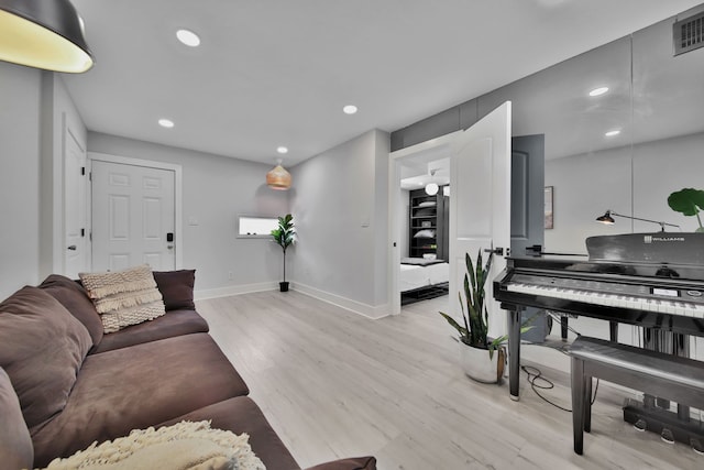 living room with light hardwood / wood-style floors