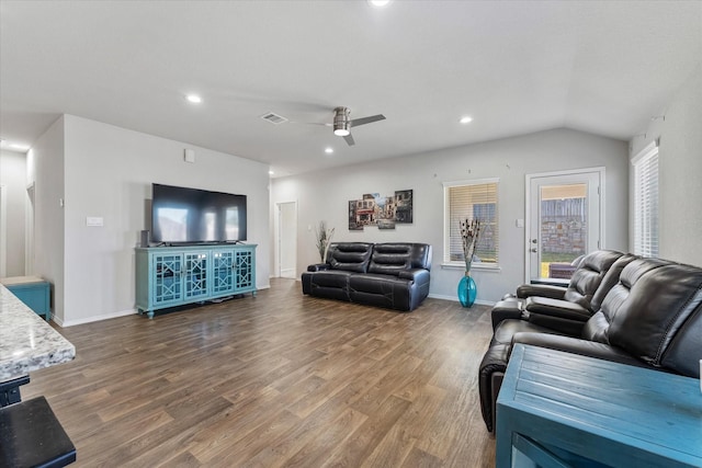 living room with lofted ceiling, hardwood / wood-style floors, and ceiling fan