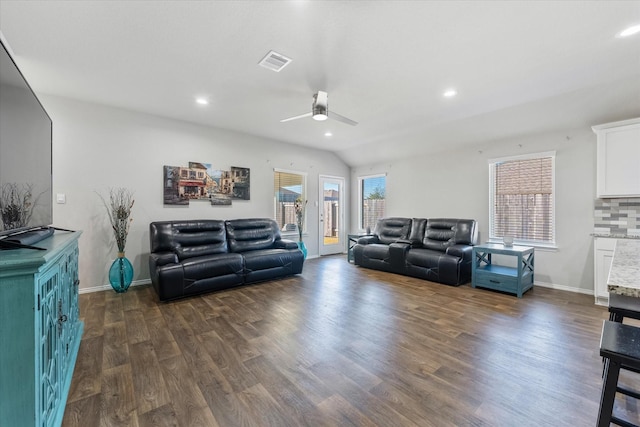 living room featuring lofted ceiling, dark hardwood / wood-style floors, and ceiling fan