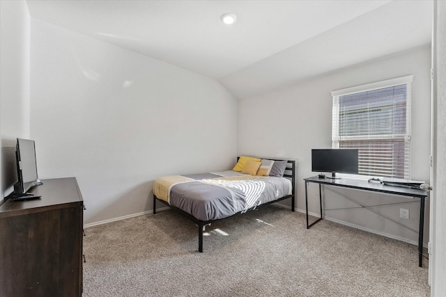 bedroom featuring light carpet and lofted ceiling