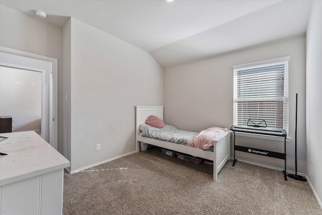 bedroom with lofted ceiling and carpet flooring