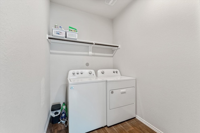 clothes washing area featuring independent washer and dryer and hardwood / wood-style floors