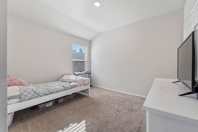 carpeted bedroom featuring vaulted ceiling