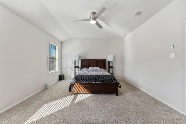 bedroom with light carpet, vaulted ceiling, and ceiling fan