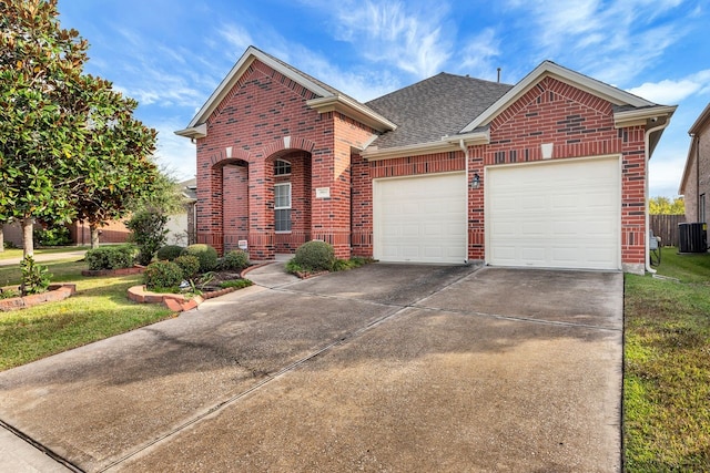 view of front of home featuring a garage and a front yard