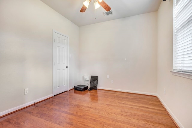 unfurnished room with light hardwood / wood-style flooring and ceiling fan