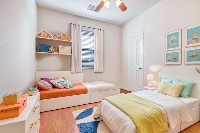 bedroom featuring light hardwood / wood-style floors and ceiling fan