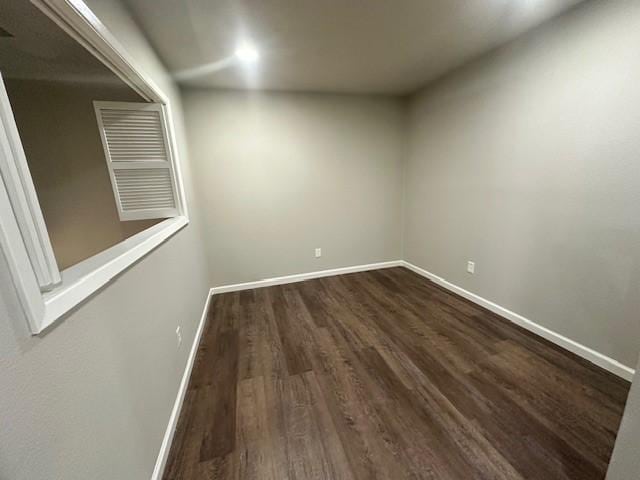 empty room with hardwood / wood-style flooring