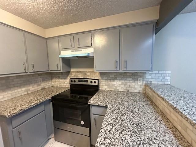 kitchen featuring gray cabinets, stainless steel electric range oven, light stone countertops, and decorative backsplash