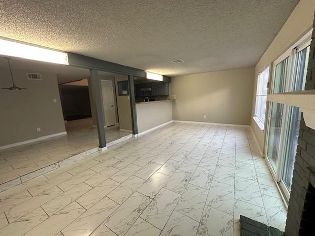 basement featuring a textured ceiling