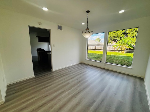 unfurnished dining area with hardwood / wood-style flooring