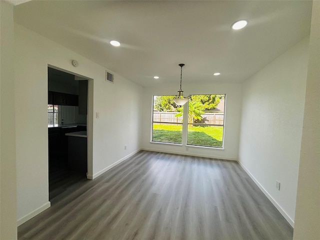 unfurnished dining area with hardwood / wood-style floors