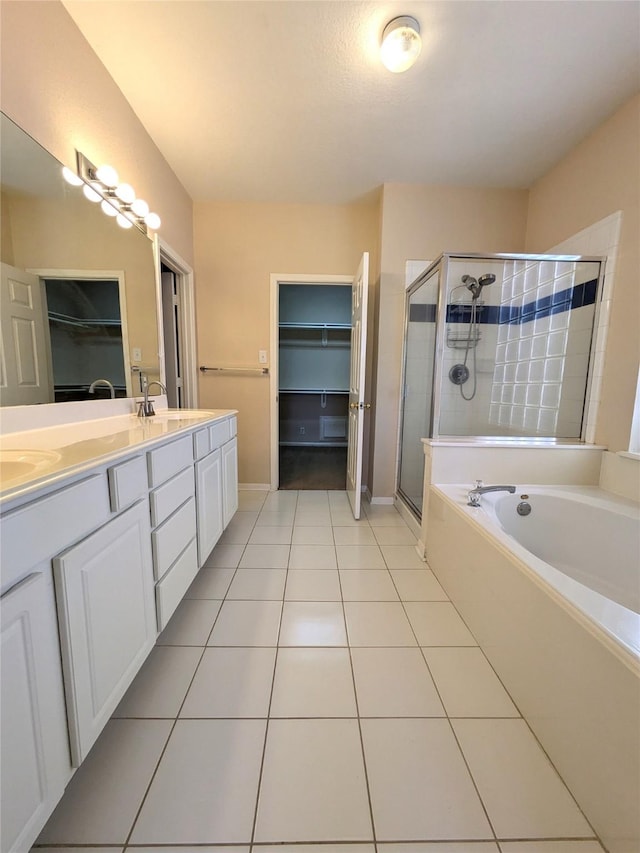 bathroom with tile patterned floors, vanity, and independent shower and bath